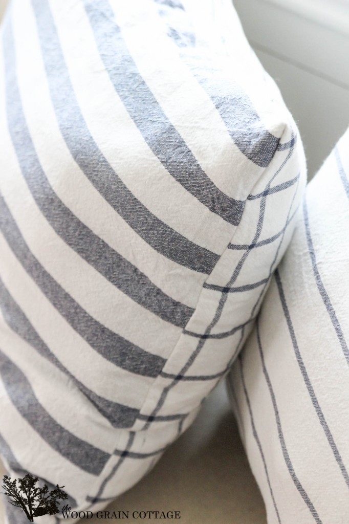 Use kitchen tea towels to make your own pillows! Full tutorial by The Wood Grain Cottage