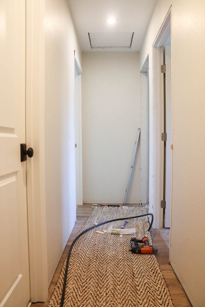 A picture of a hallway with doors installed. 