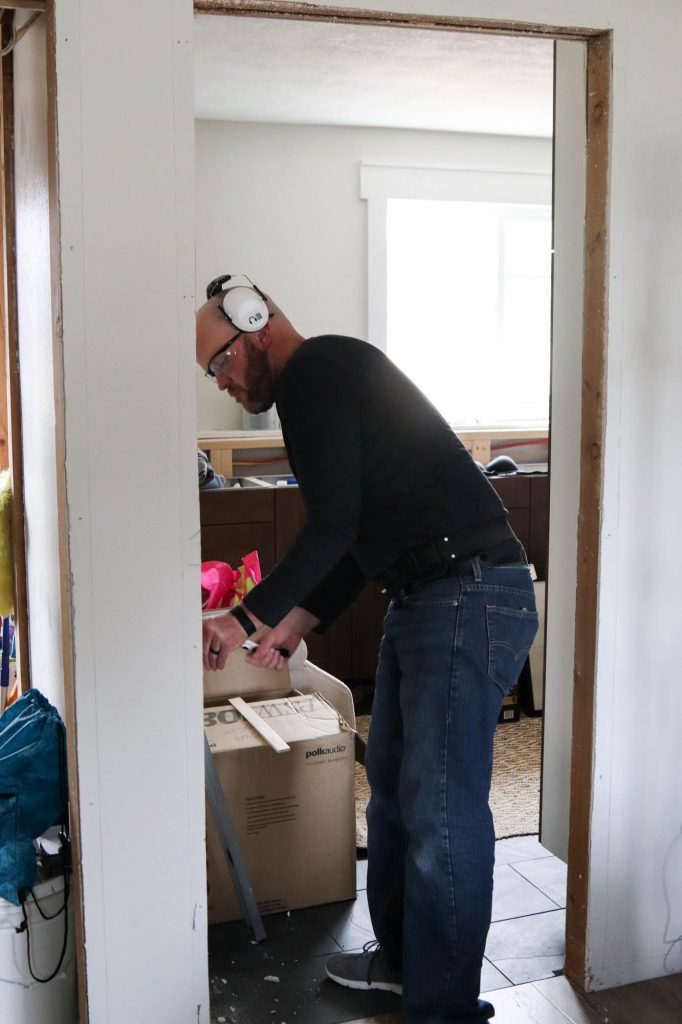A picture of a door getting ready to be installed. 