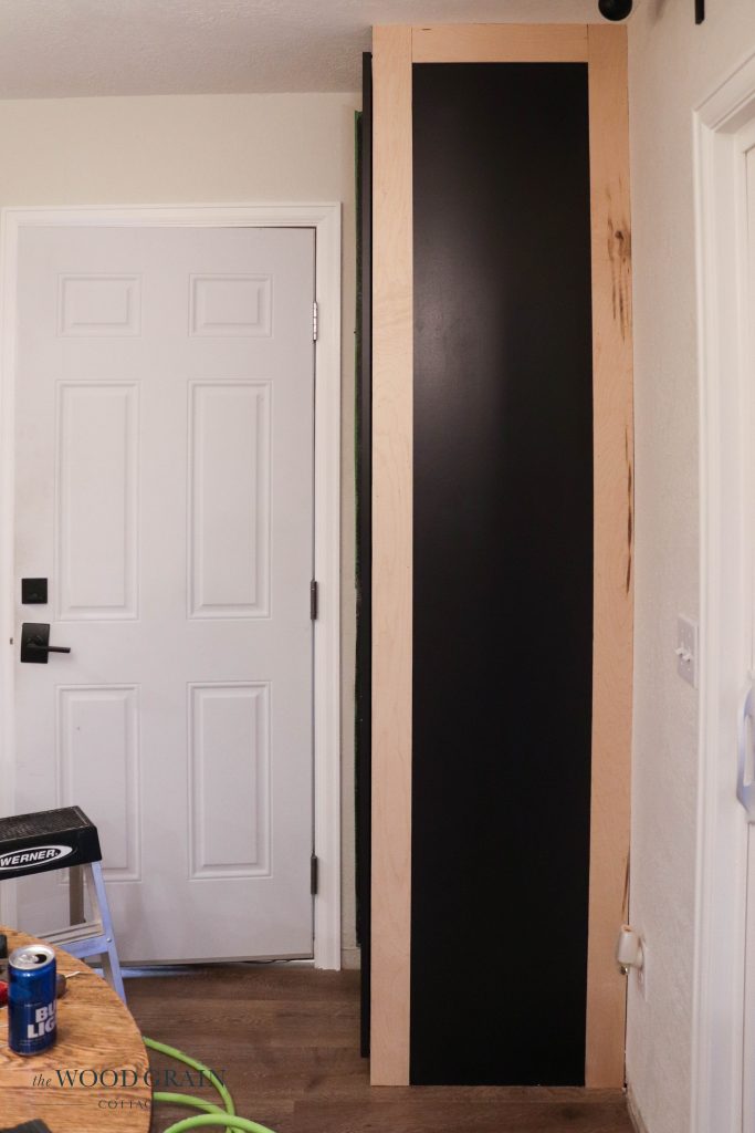 A picture of the top and bottom trim pieces being added. 