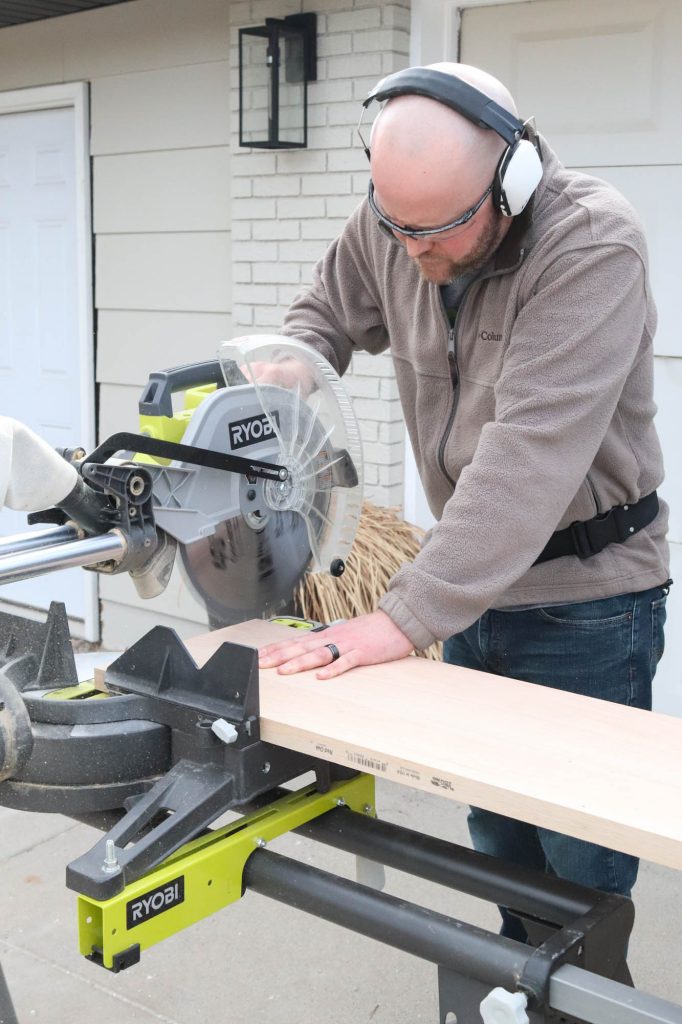 A picture of Todd trimming the new stair tread. 