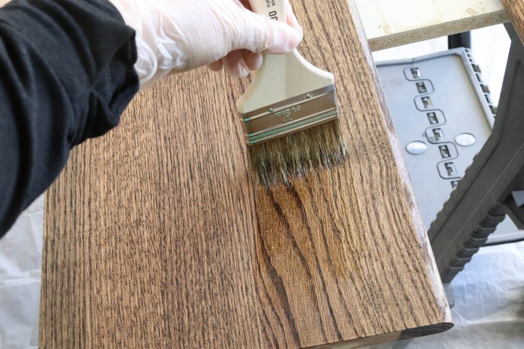 A picture of the stair treads getting polyurethane.