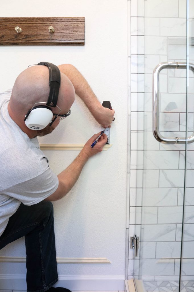 A picture of Todd measuring the wall...