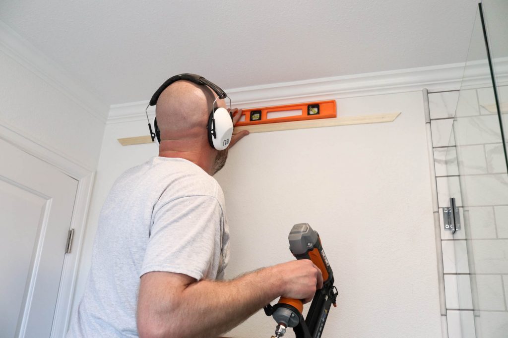 A picture of Todd installing the top box piece.