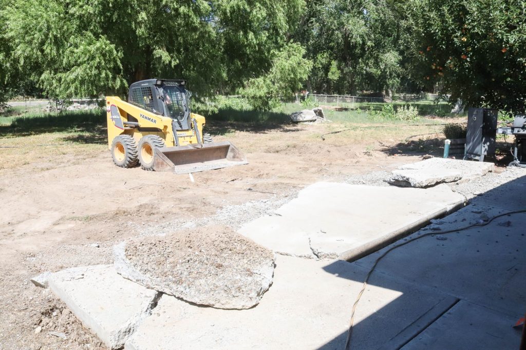 A picture of us demo'ing out the existing patio. 