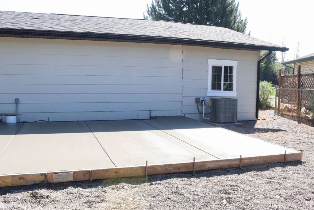 A picture of the new concrete patio being finished. 
