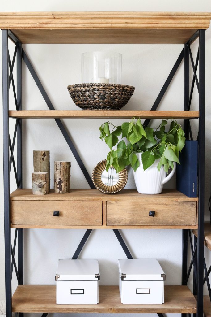 A picture of our living room shelves decorated for summer.