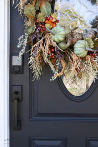 A picture of our front door with a fall wreath.