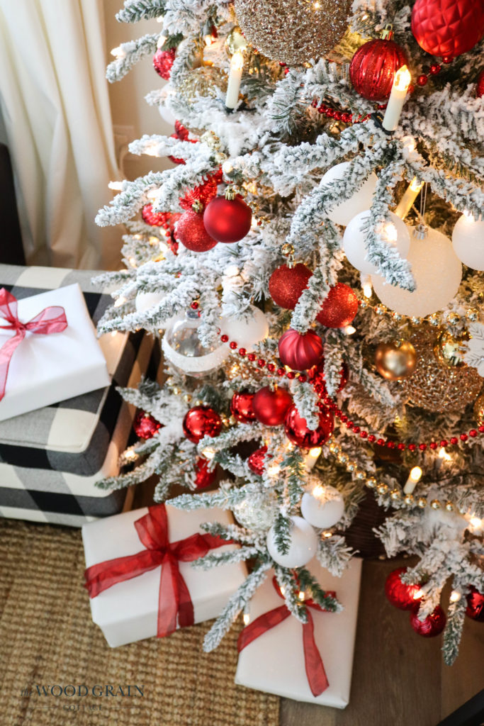 A picture of the Christmas tree with white Christmas presents below the tree.