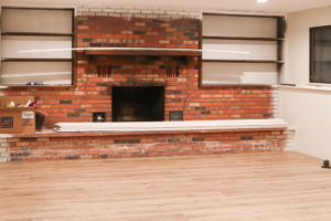 A picture of our downstairs living room and fireplace.