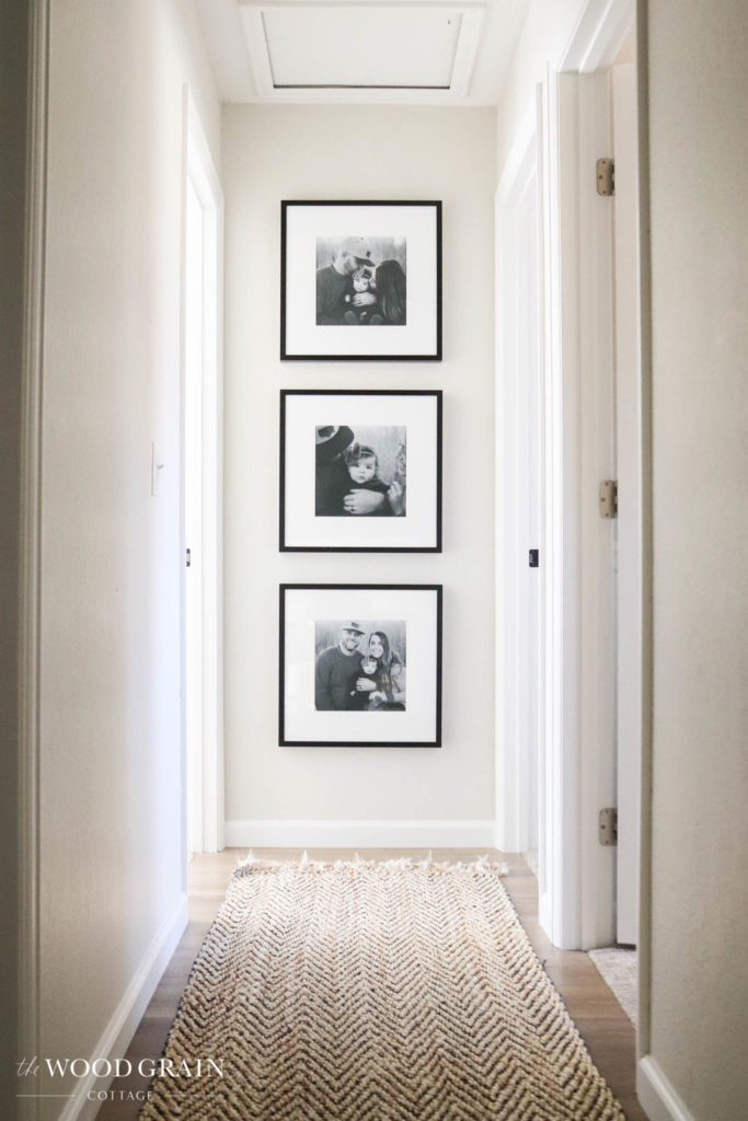 A picture showing our family pictures in the hallway.