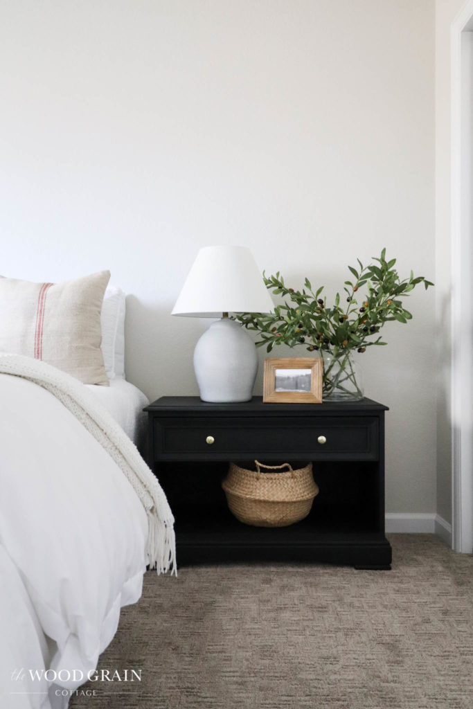 A picture of the master bedroom with the new nightstands.