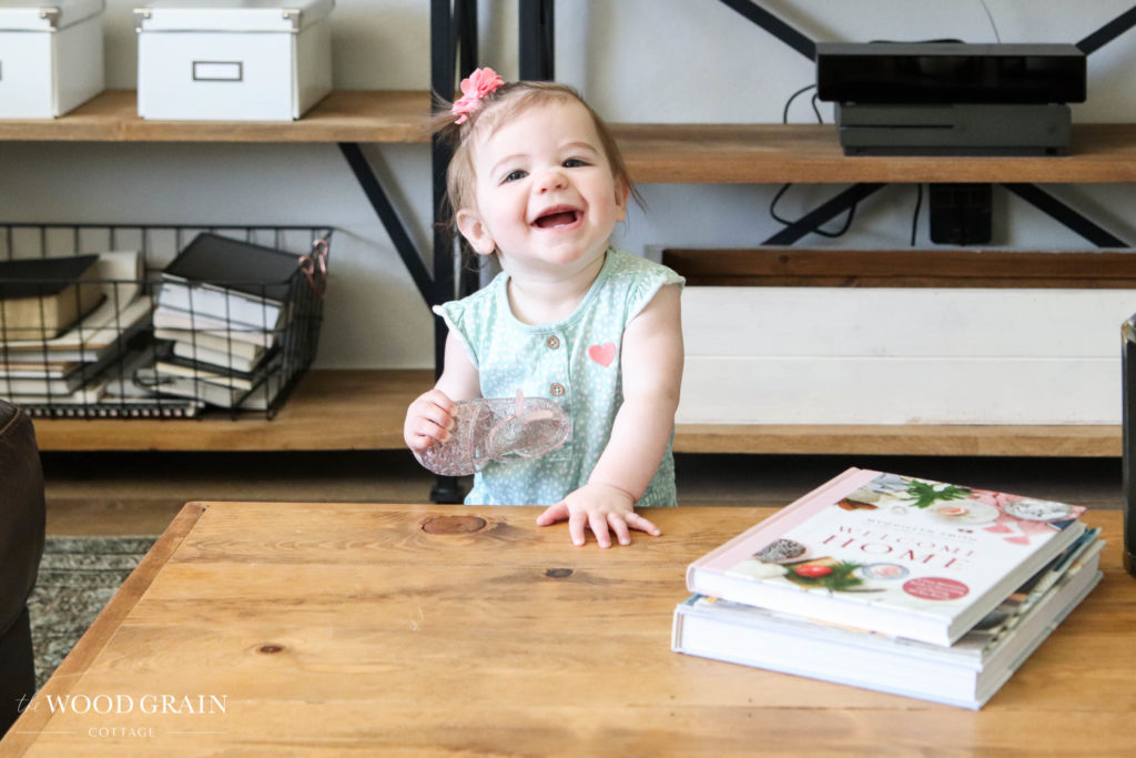 A picture of Ania smiling in the living room. 