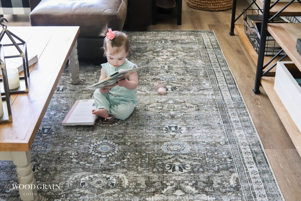 A picture of Ania sitting on our new living room rug. 