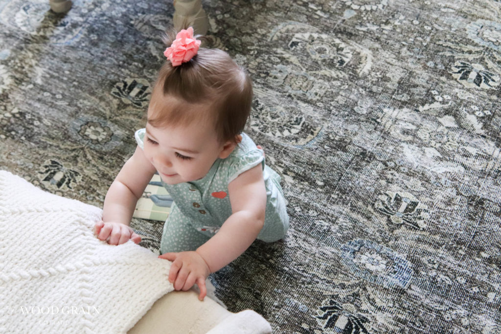 A picture of Ania on the new living room rug. 