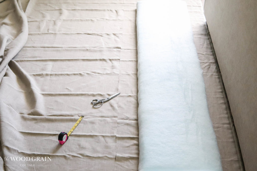 A picture of the fabric being cut to size for each panel. 