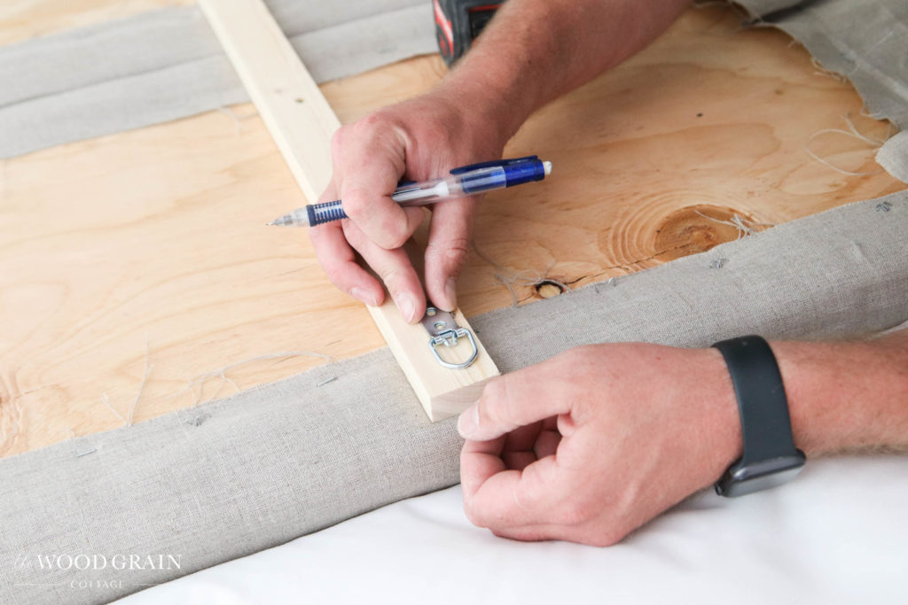 A picture of Todd installing the mounting hardware. 