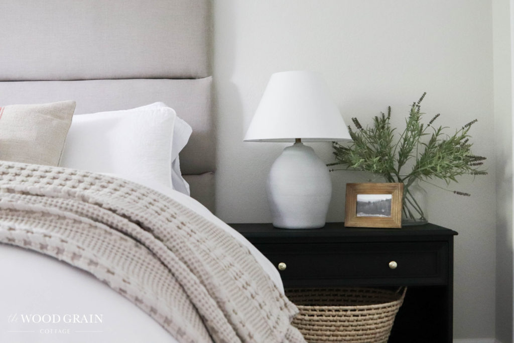 A picture of our headboard and nightstand. 