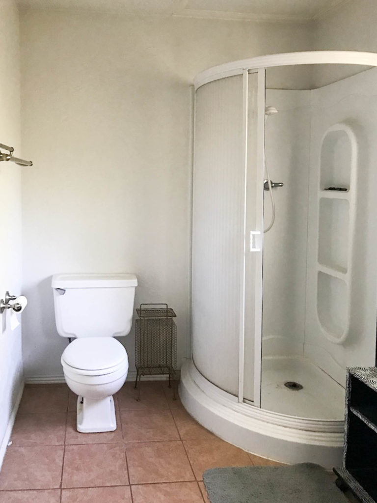 A picture of the bathroom shower before. 