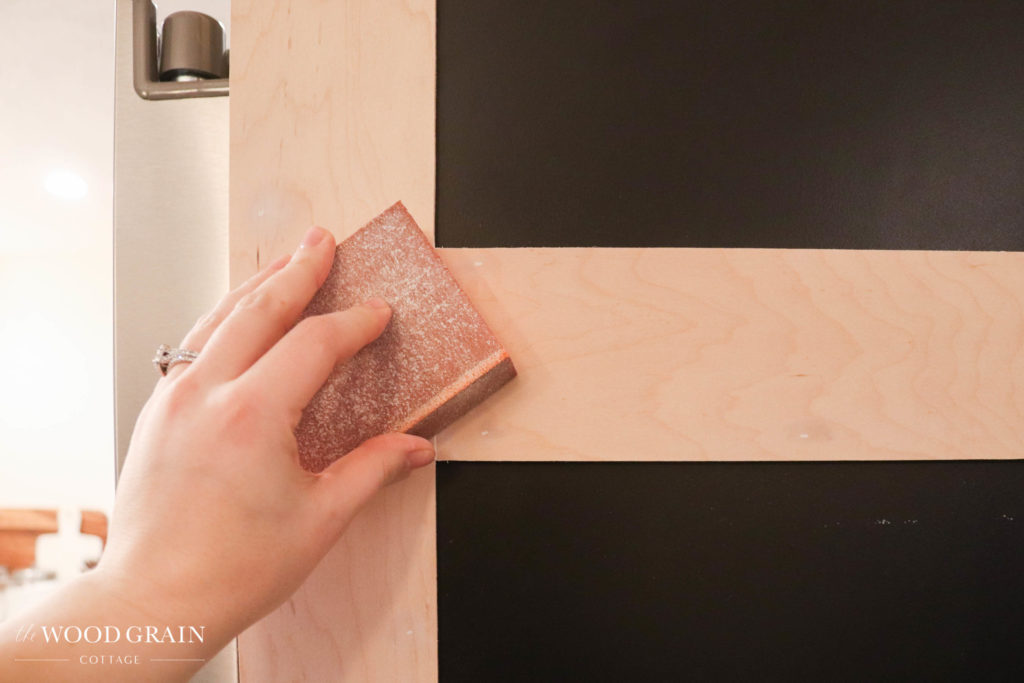 A picture of me sanding the trim work. 