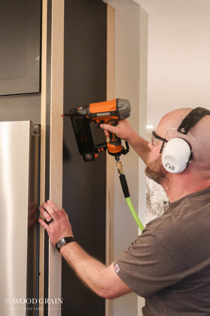 A picture of Todd installed the trim work on the end panel. 