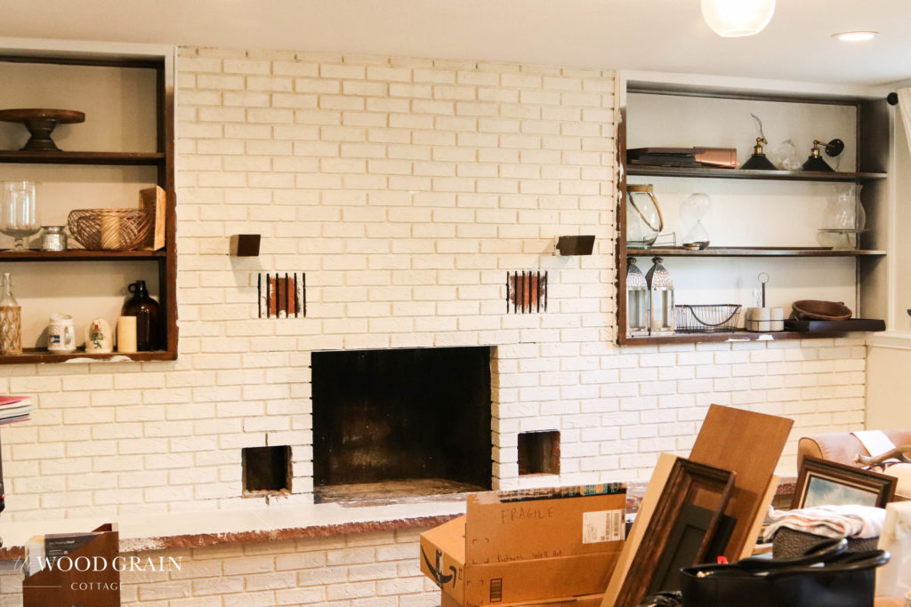 A picture of the brick fireplace painted. 
