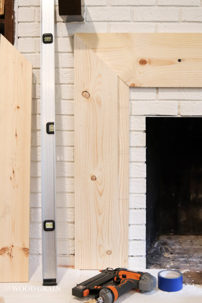 A picture of the first layer of trim boards around the fireplace.