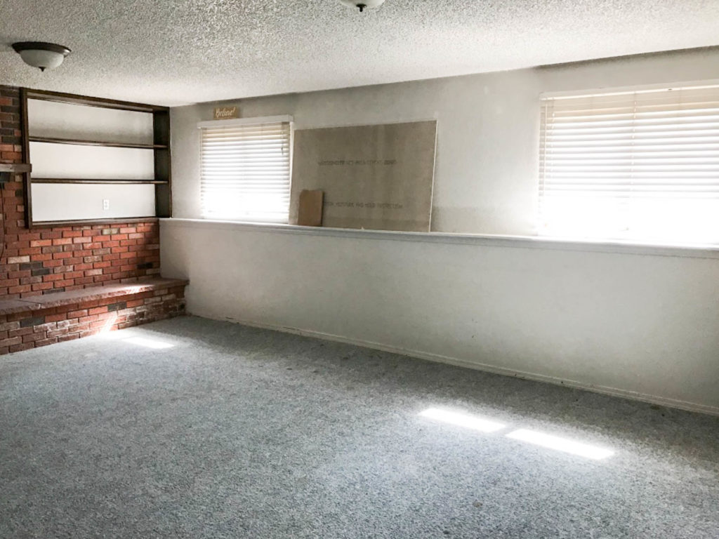 A picture of the downstairs living room when we bought the house. 