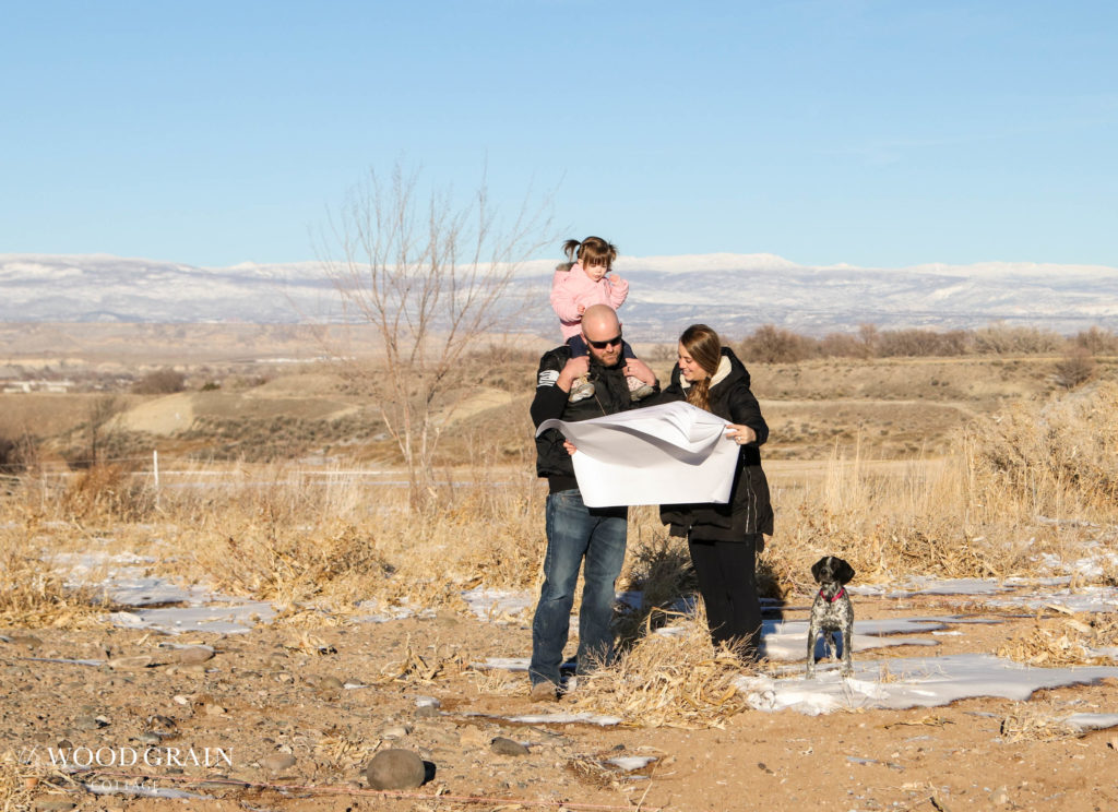 A picture of us looking over building plans. 