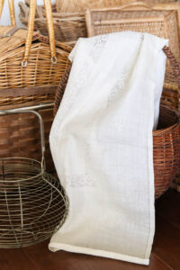 A picture of my white linen table runner.